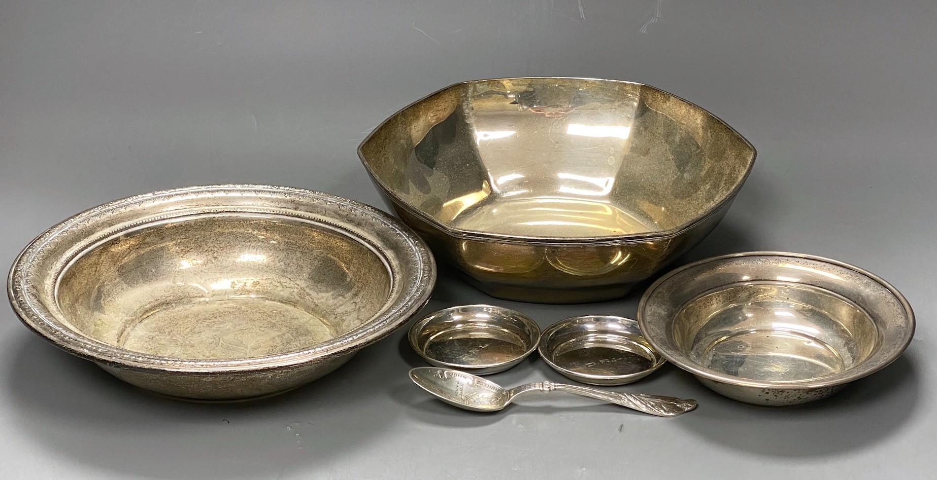 An early 20th century Tiffany & Co hexagonal sterling 925 fruit bowl, diameter 21.9cm, together with two other sterling bowls, two small sterling dishes and a sterling spoon, 29oz.